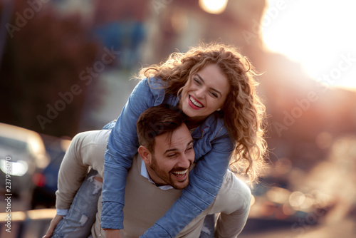 Man carrying woman on his back