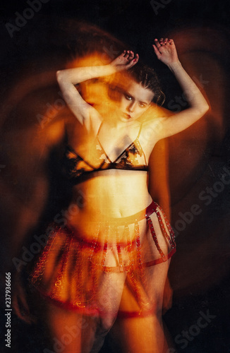 Blurry portrait of beautiful young woman. Long exposure, grunge texture effect