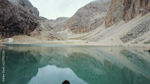 Areal view over the Dolomites - Paso Antermoia. Antermoia Lake. Drone video over the Dolomites photo