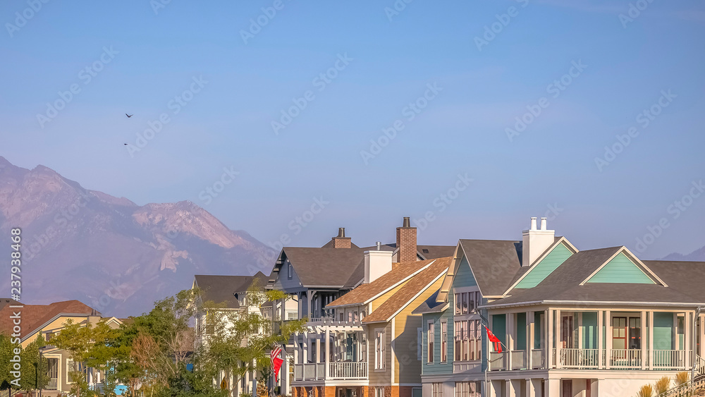 Homes by the Oquirrh Lake with mountain and sky
