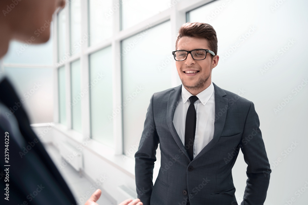 young employee standing in the hallway of the office young employee standing in the hallway of the office