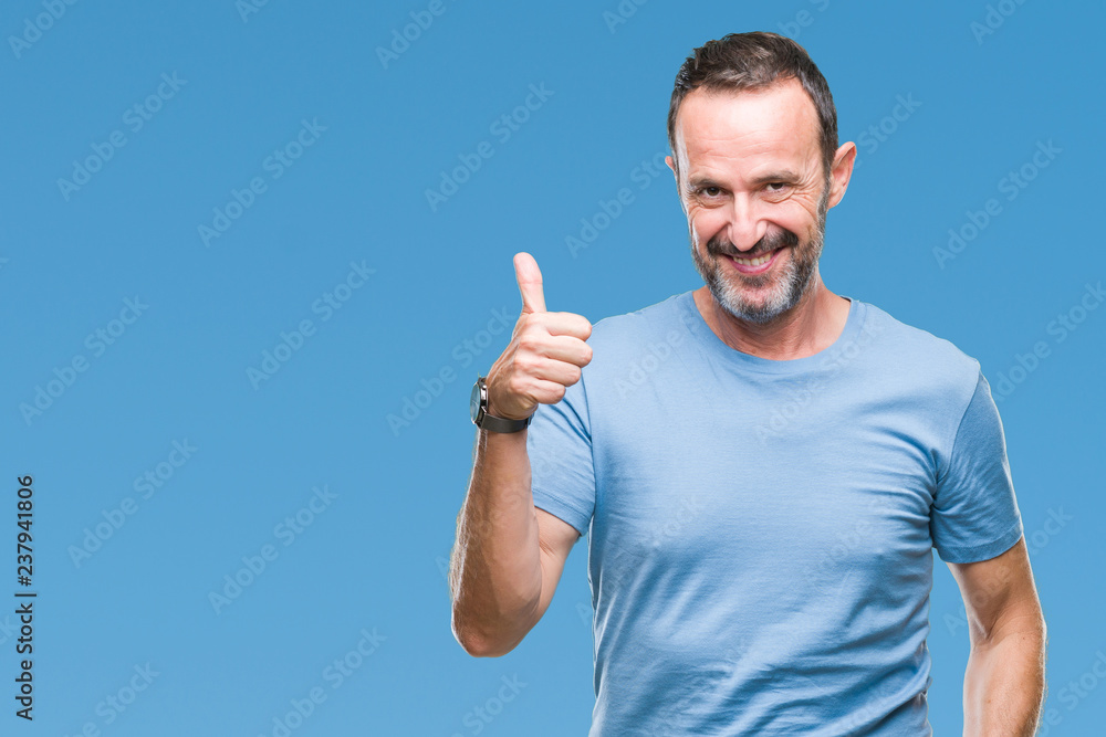 Middle age hoary senior man over isolated background doing happy thumbs up gesture with hand. Approving expression looking at the camera with showing success. Middle age hoary senior man over isolated background doing happy thumbs up gesture with hand. Approving expression looking at the camera with showing success.