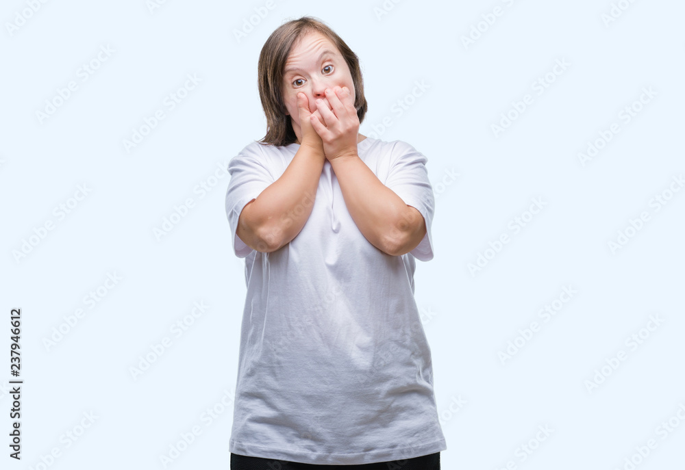 Young adult woman with down syndrome over isolated background shocked covering mouth with hands for mistake. Secret concept. Young adult woman with down syndrome over isolated background shocked covering mouth with hands for mistake. Secret concept.