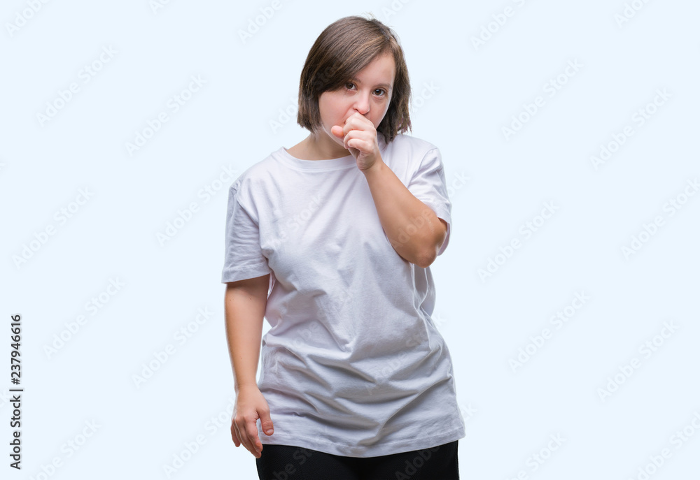 Young adult woman with down syndrome over isolated background feeling unwell and coughing as symptom for cold or bronchitis. Healthcare concept. Young adult woman with down syndrome over isolated background feeling unwell and coughing as symptom for cold or bronchitis. Healthcare concept.