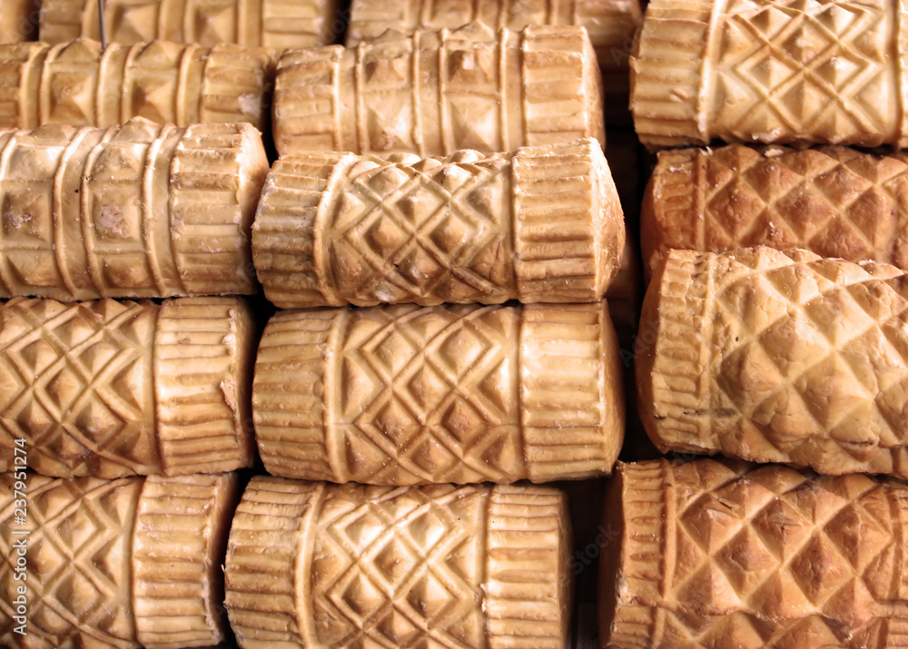 Obraz premium Oscypek cheese - traditional mountain product of Poland, Zakopane. Cheese is made of goat, cow and sheep milk