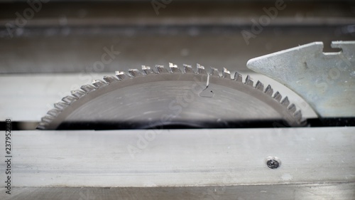 Circular saw, metal and plastic cutting, saw blade machine background.