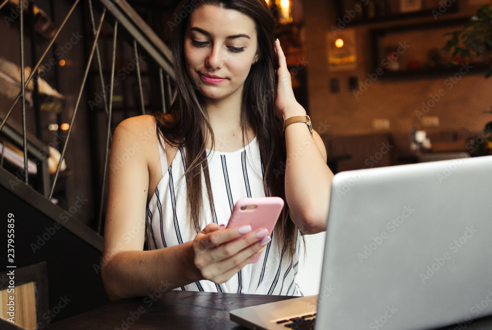 Young pretty caucasian woman in cafe in city centre with tablet laptop Young pretty caucasian woman in cafe in city centre with tablet laptop