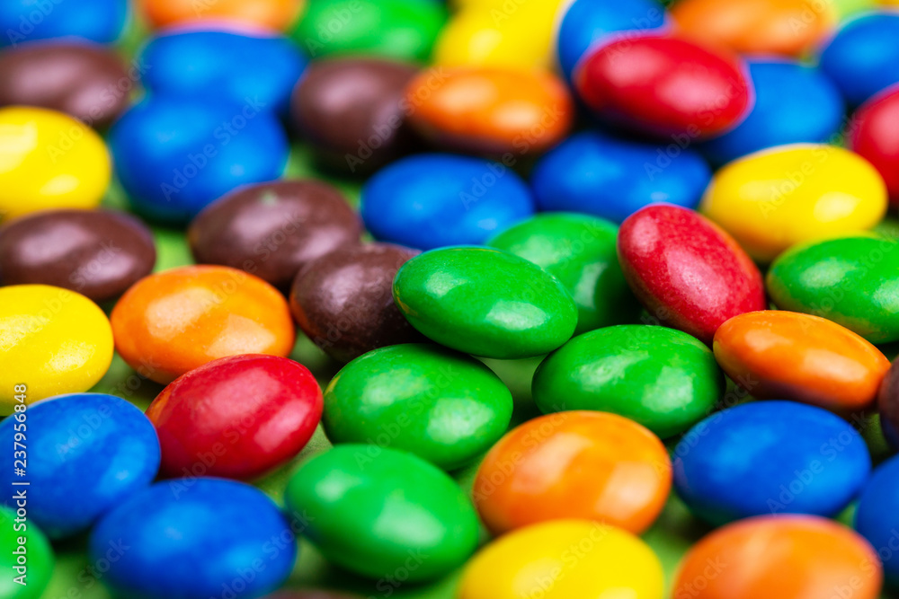 Background of glazed bright colorful chocolate candies Background of glazed bright colorful chocolate candies