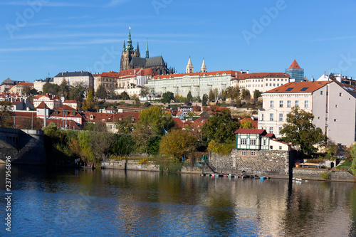 Colorful autumn Prague gothic Castle with the Lesser Town above River Vltava in the sunny Day, Czech Republic © Kajano