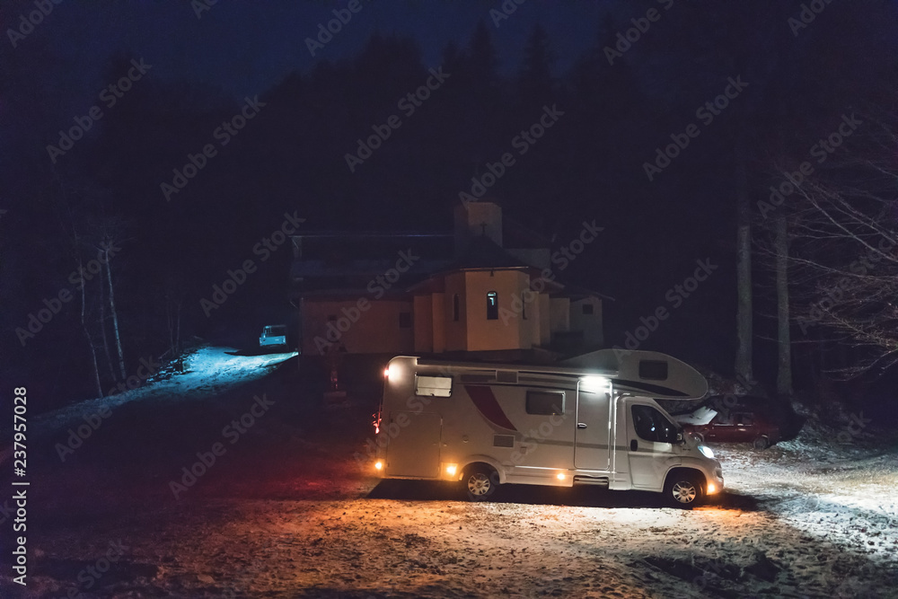 Night camping wtih camper van caravan in holiday outdoor adventure trip on the mountain. Nomad traveler camper van life Night camping wtih camper van caravan in holiday outdoor adventure trip on the mountain. Nomad traveler camper van life