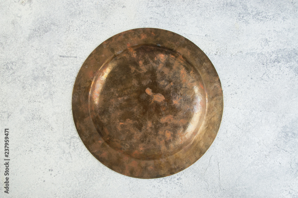 back side of vintage brass plate