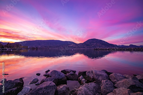 Watching from penticton beach as the purple sunsets over the okanagan lake photo