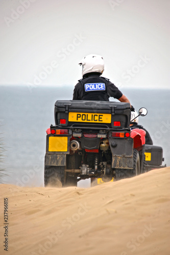 British Police on quads on the sand dunes of Formby, United Kingdom