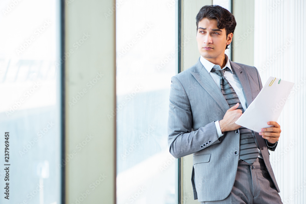Young successful businessman working at the office Young successful businessman working at the office