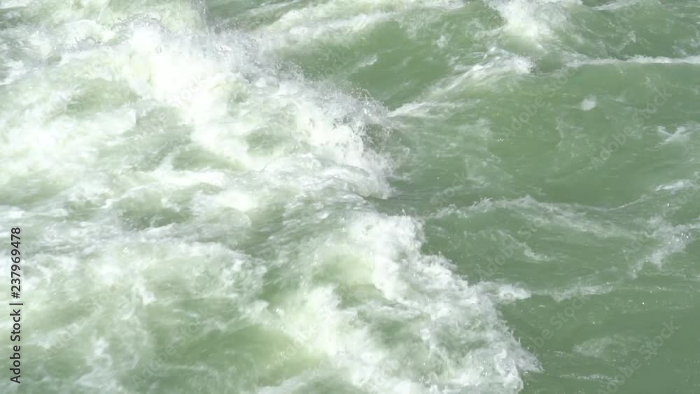 Beautiful water in a mountain river in slow motion video. Beautiful ganga river near Rishikesh, India Beautiful water in a mountain river in slow motion video. Beautiful ganga river near Rishikesh, India