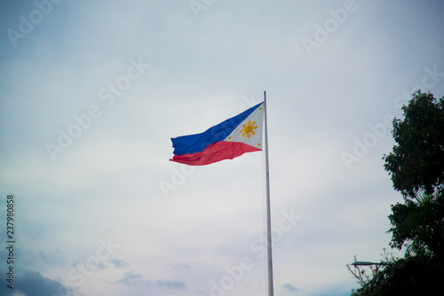 A flag of Philippines. Philippines is a country located in the south east Asia. Their climate is mostly tropical.