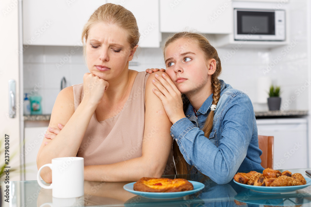 Girl apologizing to her mother