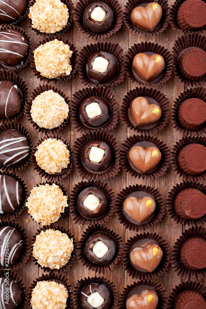 Chocolate handmade candies, pralines and truffles in assortment. Chocolate handmade candies, pralines and truffles in assortment.