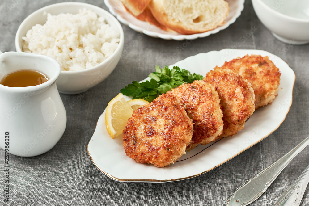 Chicken cutlets with rice on a plate for dinner
