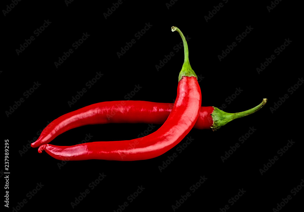Red chilli peppers on black background Red chilli peppers on black background