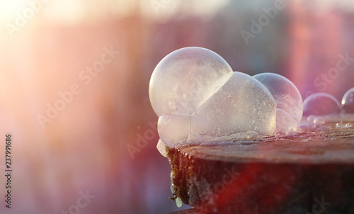 Soap bubbles freeze in the cold. Winter soapy water freezes in the air.