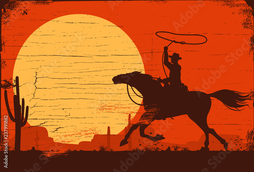 Silhouette of a cowboy riding horse at sunset on a wooden sign, vector