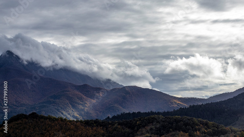 Clouds on a mountain range landscape © jordieasy