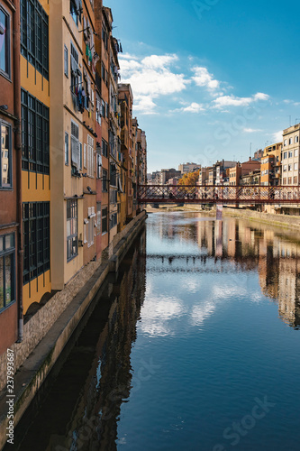 Girona landmark in Catalonia. Urban scene of river facade houses and water reflection © jordieasy