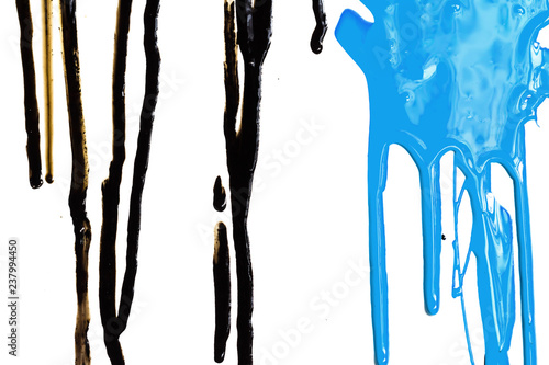Close-up of the black and blue flowing paint isolated on white background
