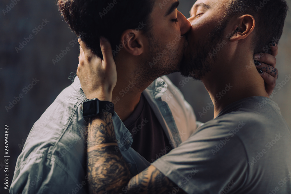 Sensual Gay Males giving deep kiss, embracing, feeling passion and love,  posing isolated over grey studio wall, close up. Stock Photo | Adobe Stock