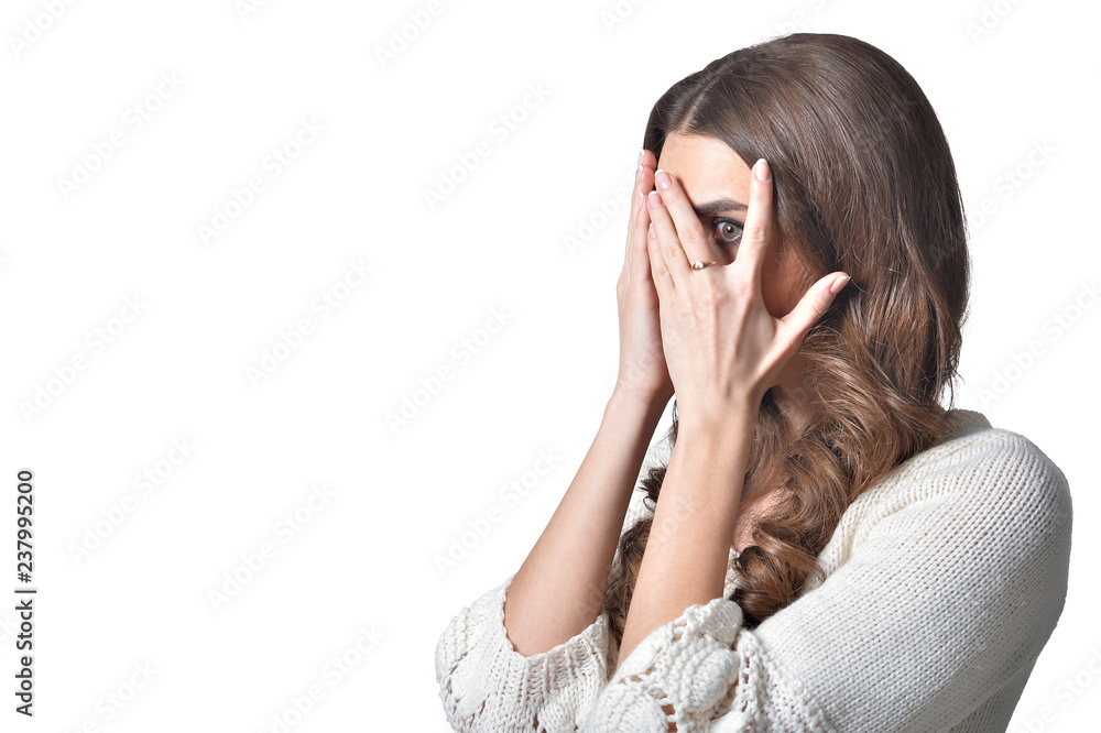 Portrait of beautiful woman covering face on white background Portrait of beautiful woman covering face on white background