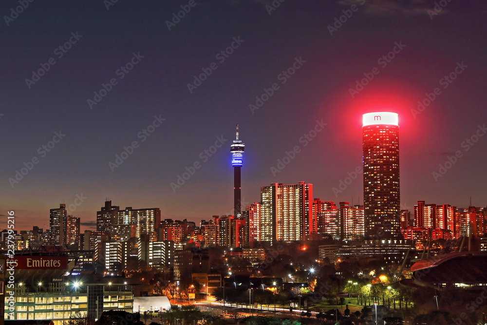 Obraz premium JOHANNESBURG, SOUTH AFRICA - June 17, 2017: Sunset view of the Johannesburg city skyline including the Ponte and Hillbrow Towers.