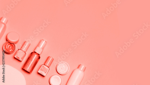 Living Coral decorative cosmetic on pink background. photo