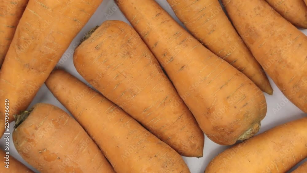 Rotation close-up, background of carrots. Rotation close-up, background of carrots.