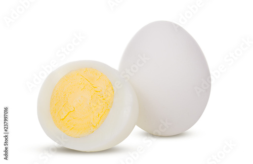Two boiled whole and sliced eggs isolated on white background
