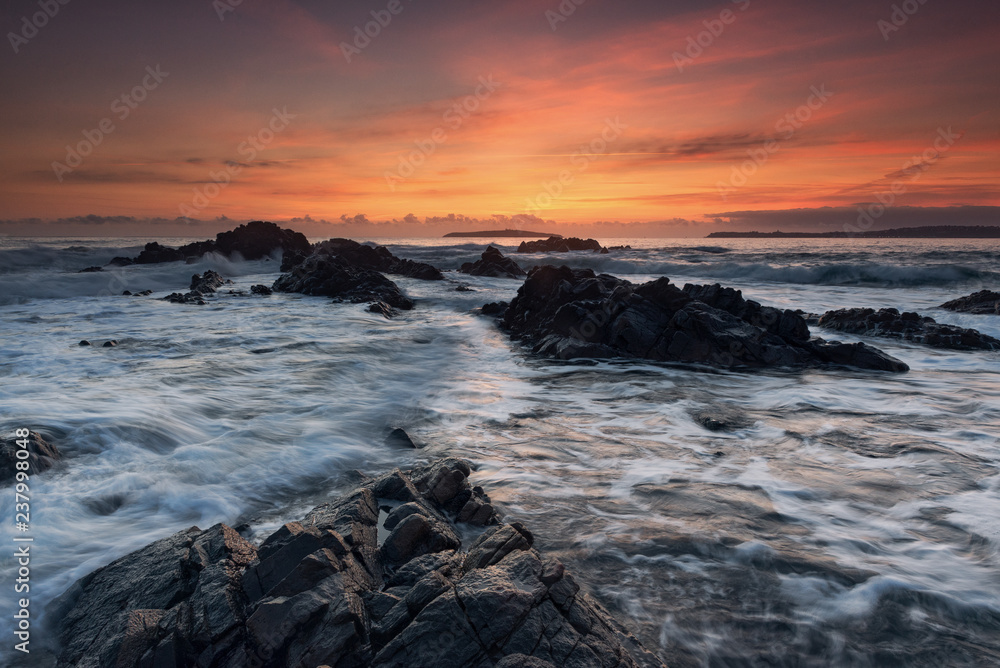 Sea sunrise, near the rocks Sea sunrise, near the rocks