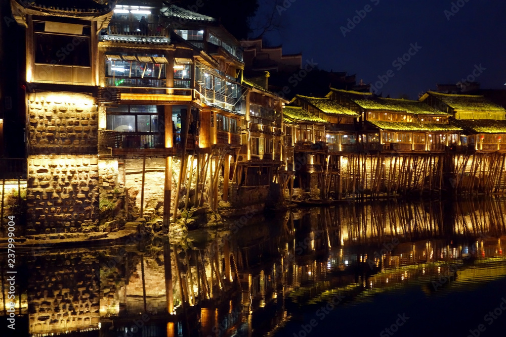 Night light scenery of Fenghuang ancient city in Xiangxi, Hunan province, China. Most famous ancient town in China. Selective, soft focus.