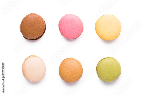 Assortment of macarons isolated over white background, top view