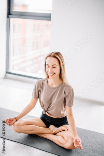 positive woman in lotus pose. full length photo. ultimate pose. Padmasana concept. holiday
