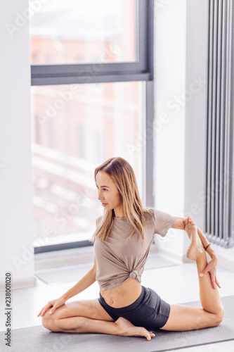 Free Download deep stretch. flexibility moves in yoga and pilates. full length side view shot. - GFXLoad