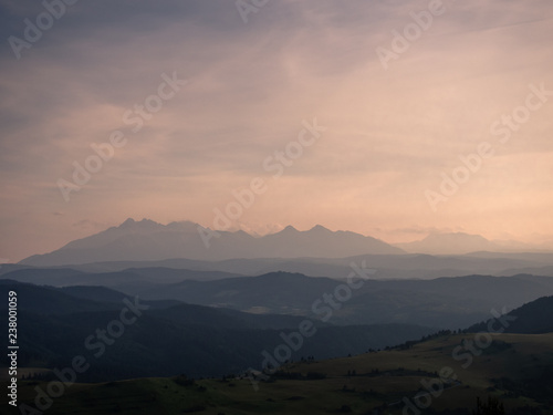 Pieniny Mountains in summer at sunset. View from Wysoki Wierch toward High Tatras.