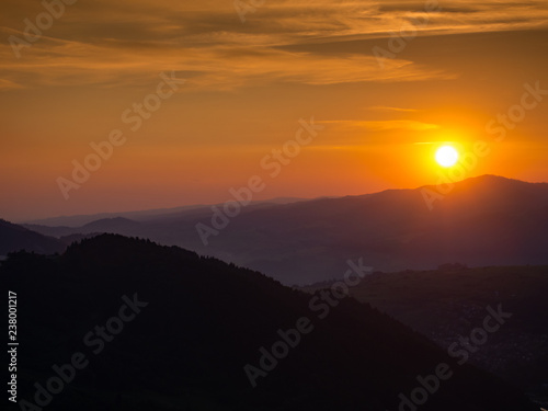 Sunset over Gorce Mountains, Luban Mount. Mount Palenica on left side. View from Mount Jarmuta, Pieniny, Poland.