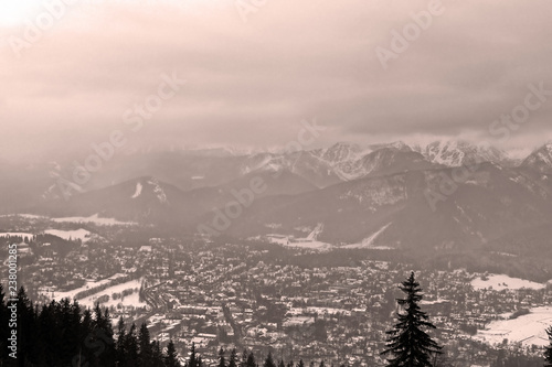 View of Zakopane and Tatra Mountains from Gubalowka in the winter in snowing weather. Zakopane is the Winter Capital of Poland © Gelia