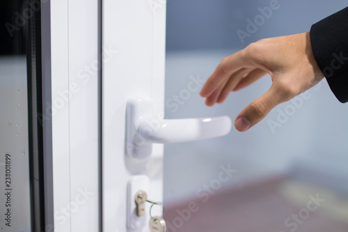 hand opening the door