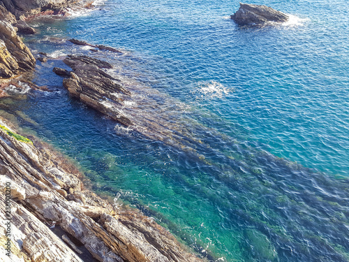 Turquoise sea seen from limestone cliffs, Liguria, Italy