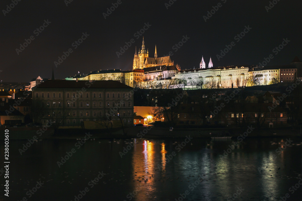 The Metropolitan Cathedral of Saints Vitus at night from Charles Bridge in Prague, Czech Republic
