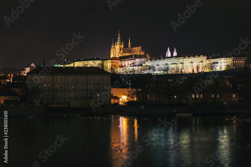 The Metropolitan Cathedral of Saints Vitus at night from Charles Bridge in Prague, Czech Republic © DaLiloveart