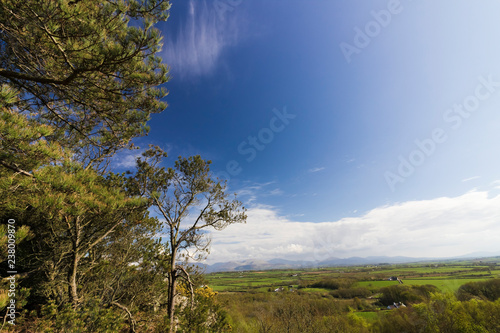 Spectacular vista from Pentraeth Forest looking eastwards towards Snowdonia Mountain Range photo