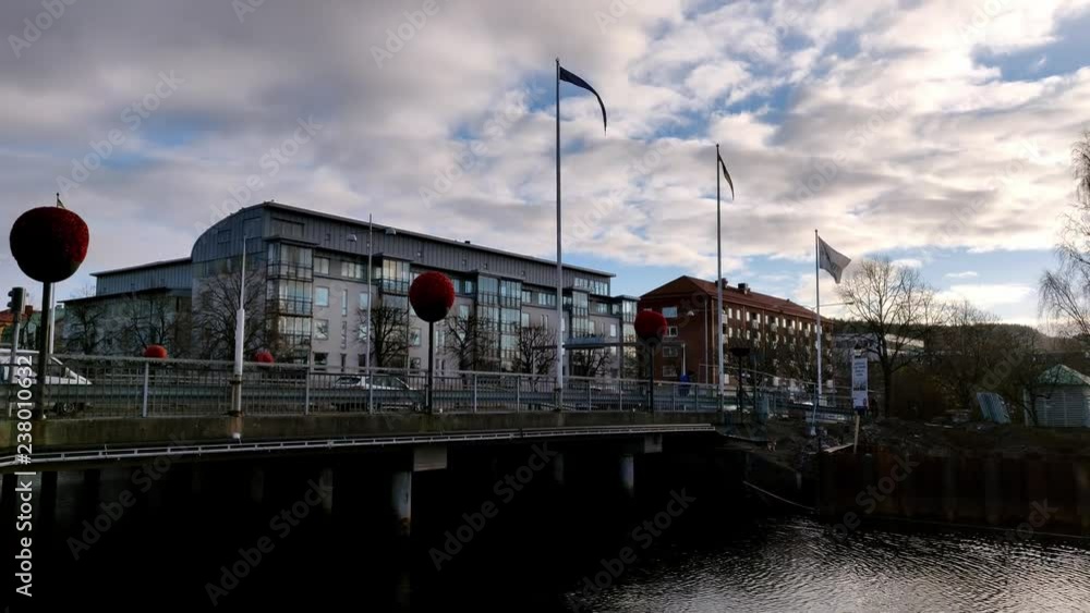 Cars Pass over a Bridge with Swedish Flags Cars Pass over a Bridge with Swedish Flags