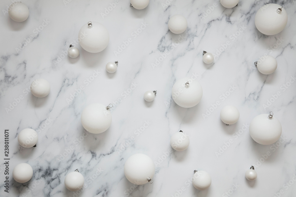 Christmas composition. white festive ball decorations on a marble background